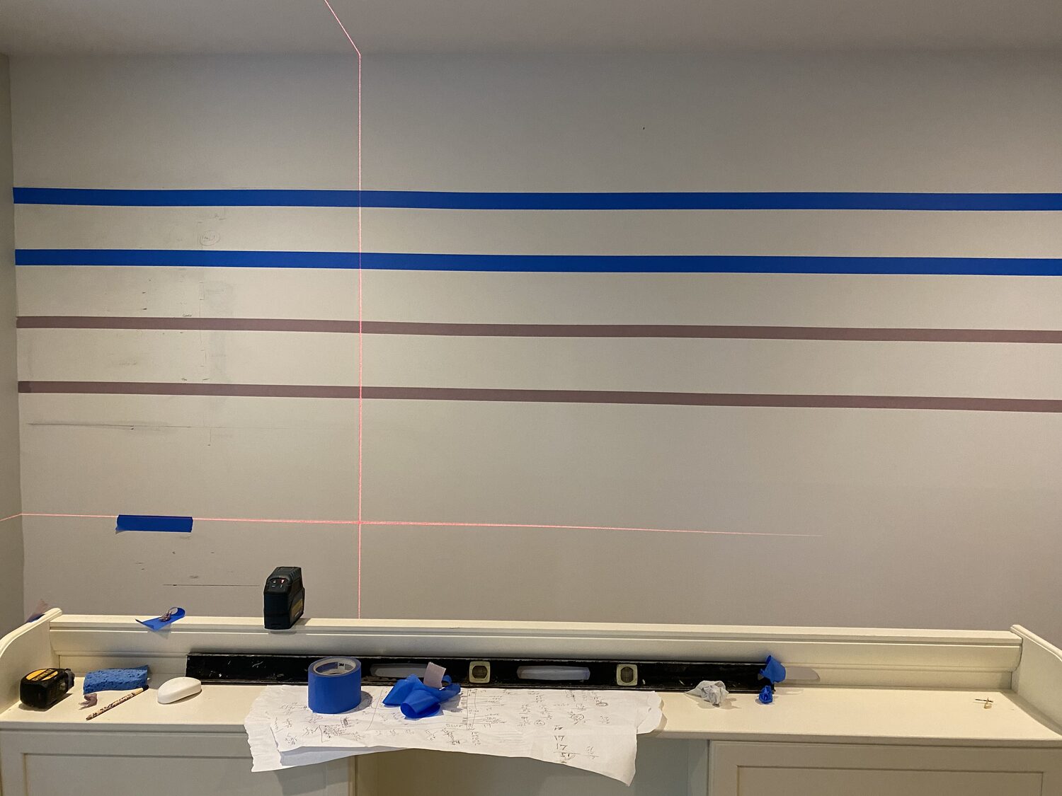 Accent wall taped and laid out before painting stripes