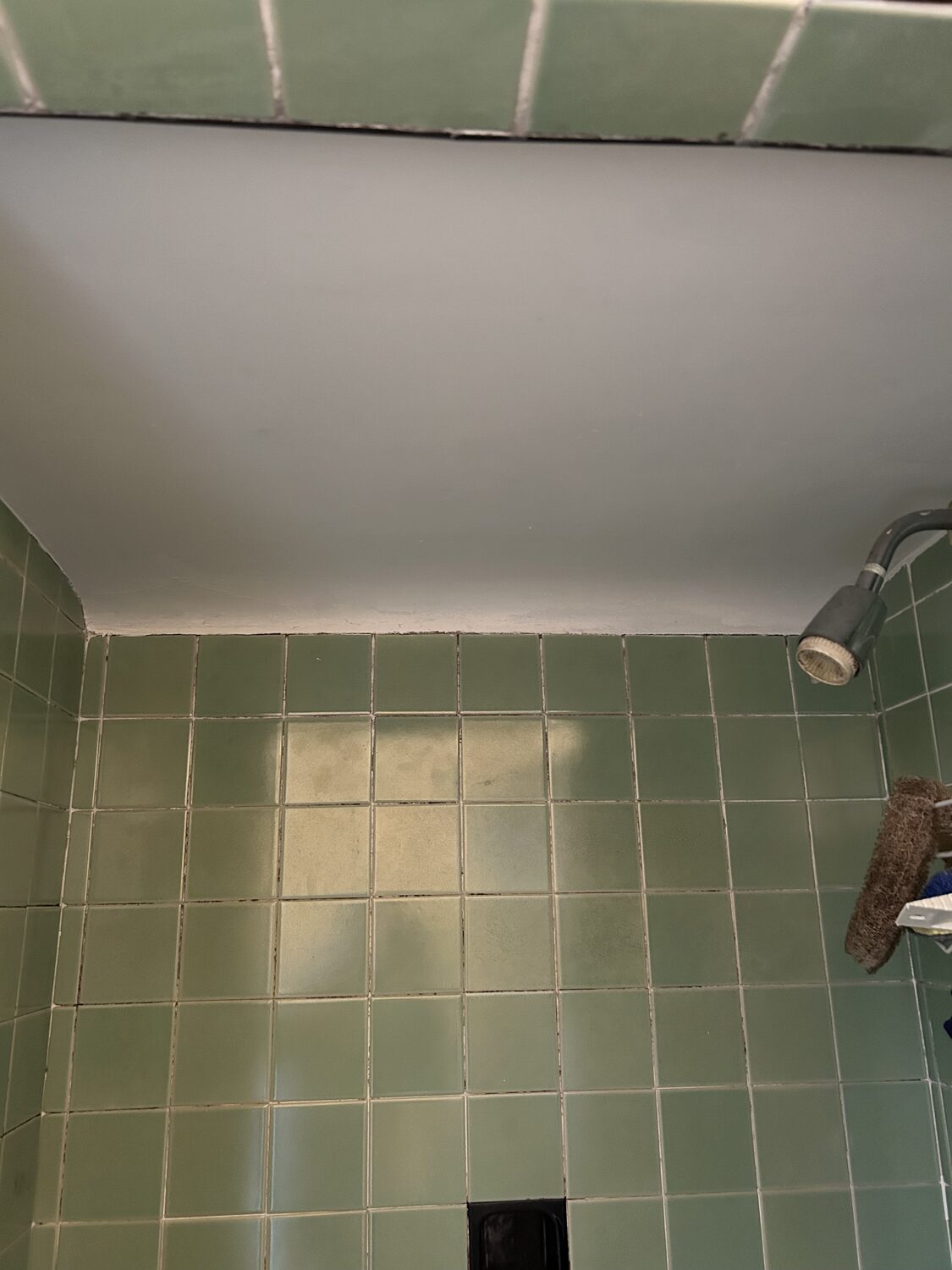 Shower ceiling repaired and repainted smooth white